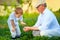 Grandfather explains grandson the nature of plant growth