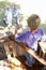 Grandfather, Father And Son Building Tree House Together