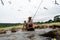 Grandfather fisher in straw hat and little male grandkid enjoying leisure activity use fishing rod