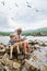 Grandfather fisher in straw hat and little male grandkid enjoying leisure activity use fishing rod