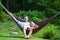 Grandfather and girl in hammock