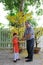 Grandfather giving lucky money to grandson on the first day of Vietnamese lunar new year Tet