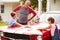 Grandfather With Grandchildren Cleaning Restored Classic Car