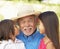 Grandfather With Grandchildren In Garden