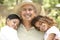 Grandfather With Grandchildren In Garden