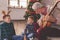 Grandfather and grandchildren singing Christmas songs