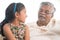 Grandfather and granddaughter communicate