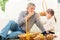 Grandfather And Granddaughter Eat Pastry