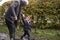 Grandfather And Granddaughter Taking Dog For Walk