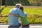 Grandfather and grandson hugging on berth