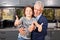 Grandfather and grandson keep their thumbs up