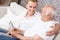 Grandfather and grandson with photo in frame