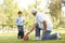 Grandfather And Grandson Playing American Football