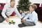 Grandfather And Grandson Playing With Toy Car