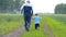Grandfather and grandson running in the countryside
