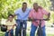 Grandfather grandson and son bike riding