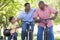 Grandfather grandson and son bike riding