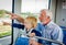 Grandfather and Grandson Spend Time Together on Train