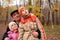 Grandfather with grandsons in forest