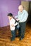 Grandfather helps grandson get ready for school -