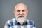 Grandfather pensioner, retiree concept. Portrait of happy senior man smiling. Close-up studio portrait of senior man