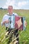 Grandfather plays accordion in field