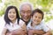 Grandfather posing with grandchildren