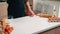 Grandfather sieving flour on wooden table