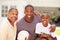 Grandfather With Son And Grandson Playing Volleyball