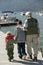 Grandfather and two grandsons on pier