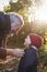 Grandfather Tying Granddaughter`s Scarf On Autumn Walk