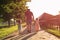 Grandfather walking with his granddaughters on the farm.