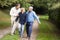 Grandfather walking with son and grandson