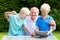 Grandkids teaching grandpa to use tablet pc