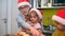 Grandma and grandchildren preparing Xmas meal in the kitchen in cheerful atmosphere together. Christmas, family, together.