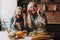 Grandma and Granddaughter Having Fun in Kitchen