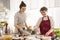 Grandma and granddaughter preparing dinner