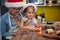 Grandma and granddaughter preparing Xmas meal in the kitchen together. Christmas, family, together