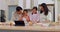 Grandma, mother and children learning baking in a home kitchen counter together to prepare dessert as a skill or care