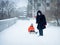 Grandma pulls sled with baby. Winter walk near the house.