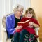 Grandma Reading to Her Grand Daughter.