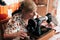 Grandma sewing on vintage sewing machine, her hands pushing pink fabric