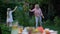Grandma teaches granddaughter how to play throw and catch game, active lifestyle