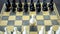 Grandmaster plays chess on a chessboard