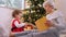 grandmother and baby with christmas gift and decor