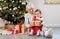 grandmother and baby girl with christmas gifts