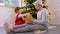 grandmother and baby girl opening christmas gift