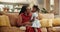 Grandmother, child and hug or communication in home, affection and bonding or care in living room. Black family