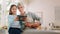 Grandmother, child and tablet in silly selfie, goofy or funny faces in the kitchen together at home. Grandma and little