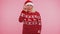 Grandmother in Christmas sweater make gesture raises finger came up with creative plan good idea